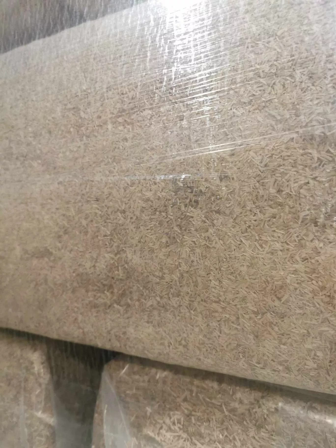 Close-up of stretch-wrapped pallet with LinoBed flax bedding bags