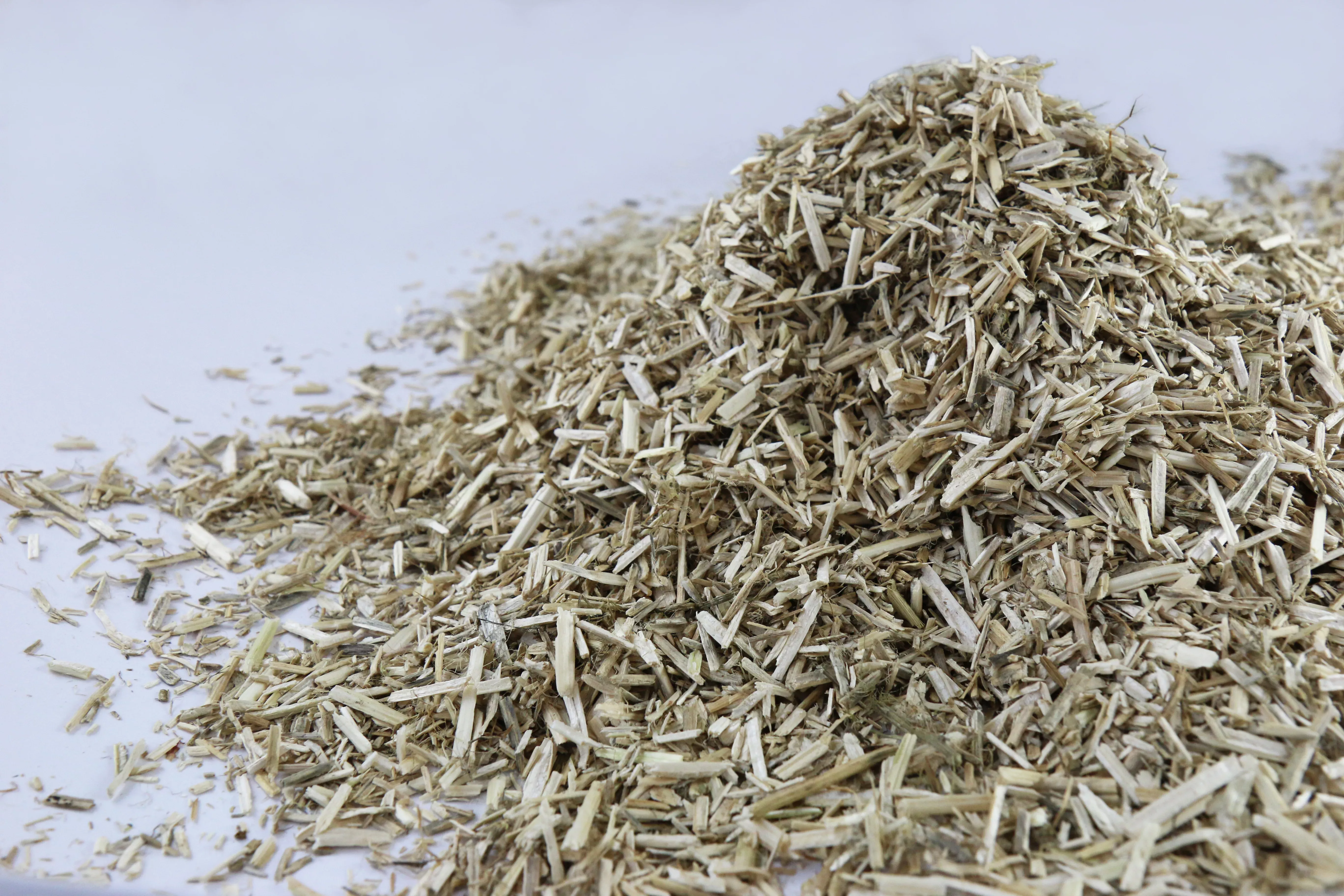 Pile of LinoBed flax bedding on white background